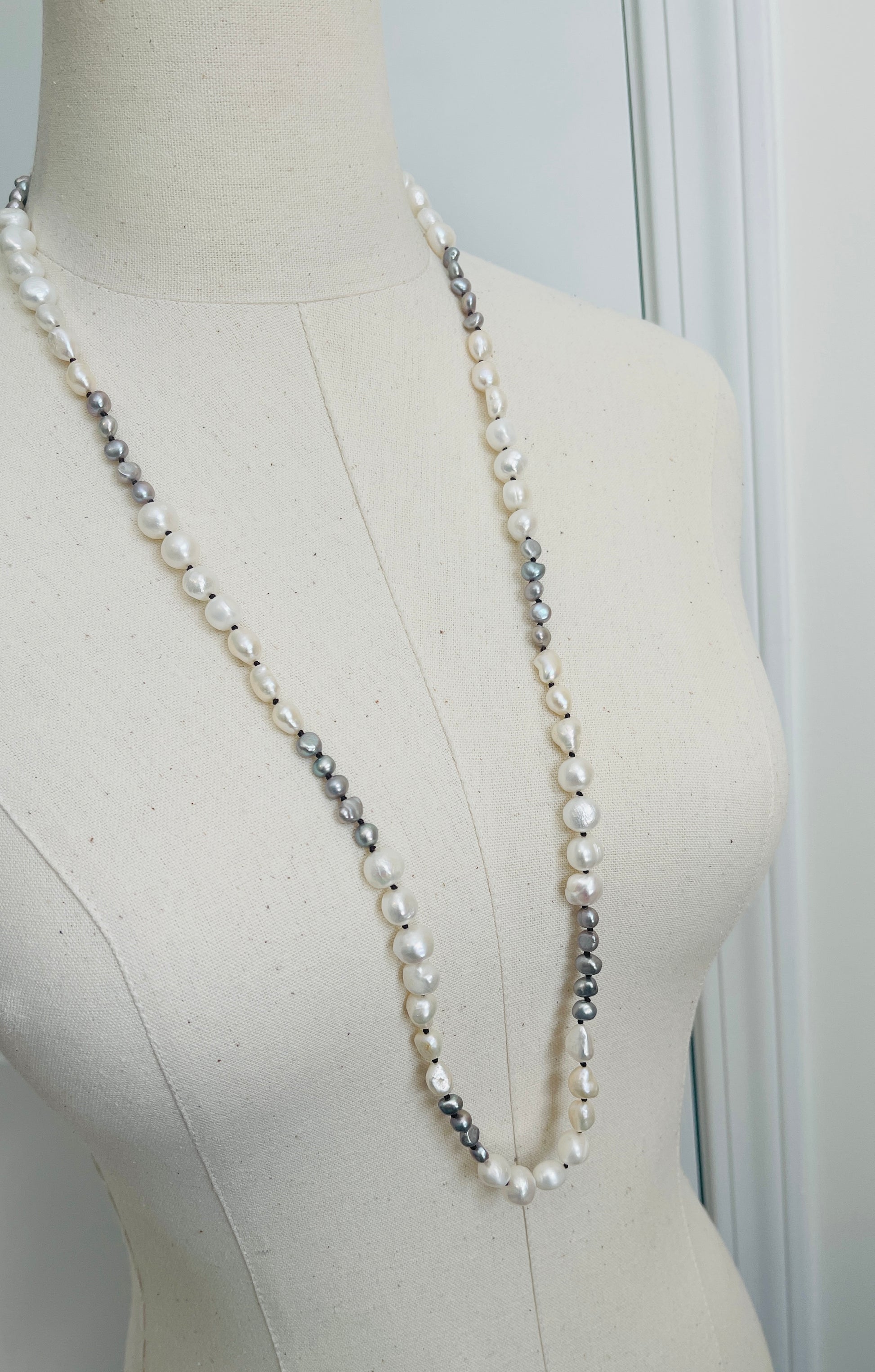 Ivory & Peacock Pearl Necklace displayed on mannequin